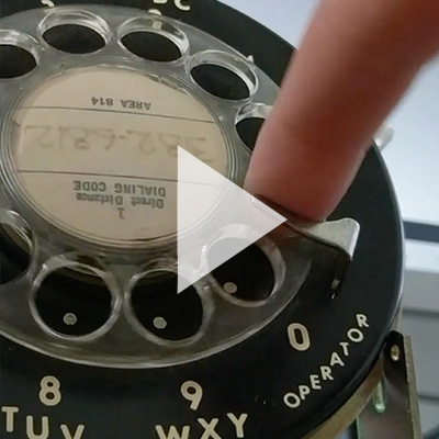 a rotary phone spelling out hello world 